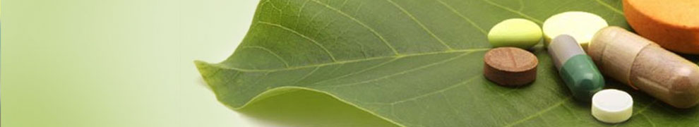 vitamins sitting on a green leaf